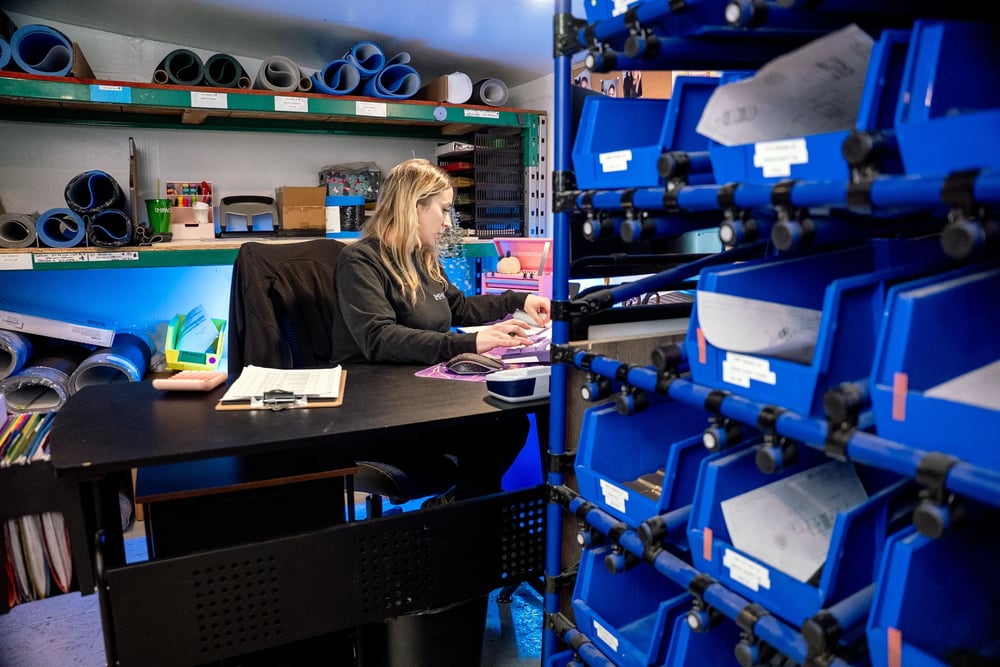 Lany at her workstation in the storage area. 